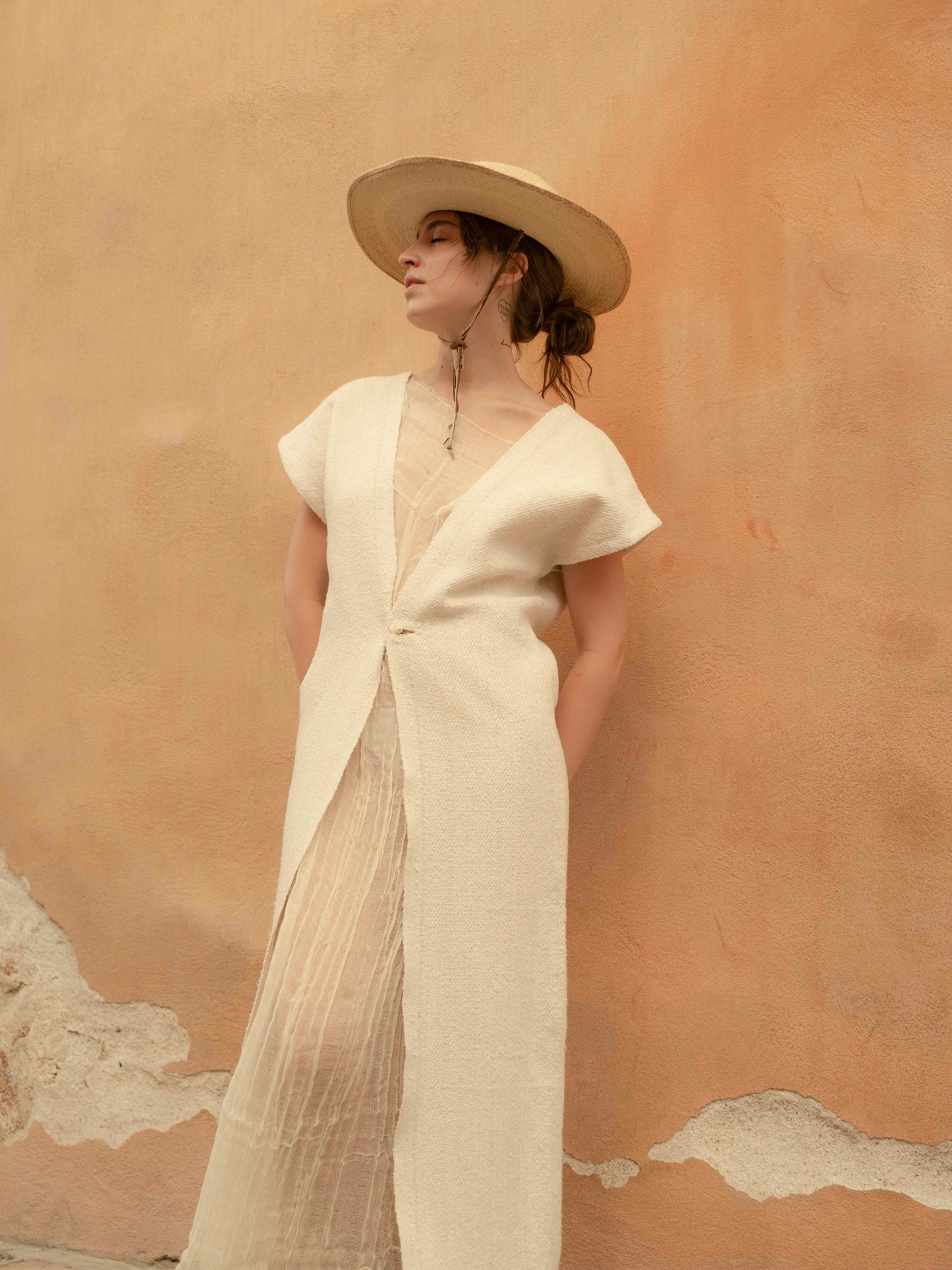 Chaleco largo de jerga unido a mano